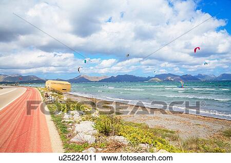 Stock Image - Kitesurfing on beach, Alcudia, Majorca, Balearic Islands, Spain, Europe. Fotosearch