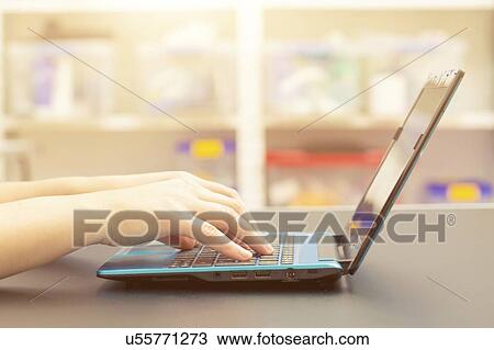 Stock Image - Laptop use.. Fotosearch