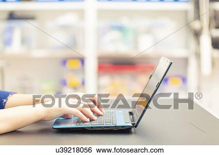 Stock Photograph - Laptop use.. Fotosearch