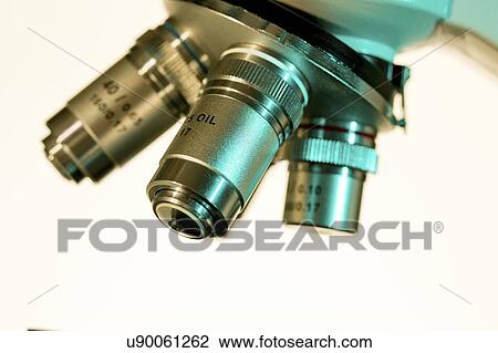 Stock Image - Light microscope lenses.. Fotosearch