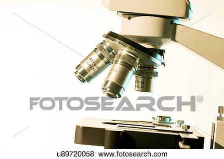 Stock Photo - Light microscope stage and lenses.. Fotosearch