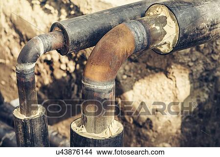 Maintenance of industrial pipes. View Large Photo Image Picture - Maintenance of industrial pipes.. Fotosearch
