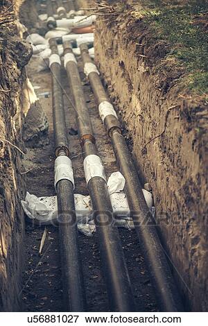 Stock Photo - Maintenance of industrial pipes.. Fotosearch