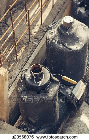 Stock Photograph - Maintenance of industrial pipes.. Fotosearch