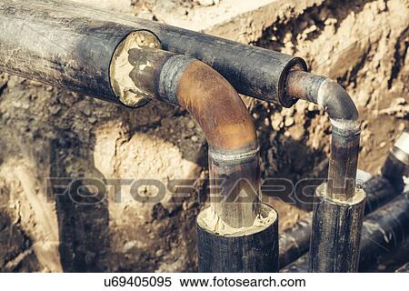 Stock Photography - Maintenance of industrial pipes.. Fotosearch