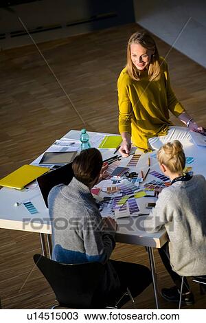Male and female designers discussing colour swatches on design studio table View Large Photo Image Stock Image - Male and female designers discussing colour swatches on design studio table. Fotosearch