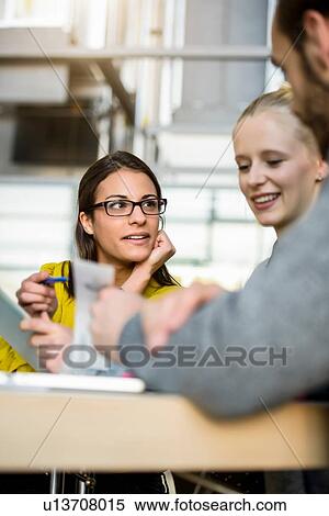 Male and female designers looking at swatches on design studio desk View Large Photo Image Stock Photography - Male and female designers looking at swatches on design studio desk. Fotosearch