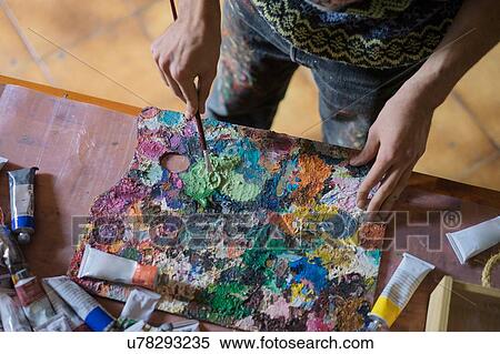 Male artist mixing oil paint on palette in artists studio, mid section View Large Photo Image Stock Photography - Male artist mixing oil paint on palette in artists studio, mid section. Fotosearch