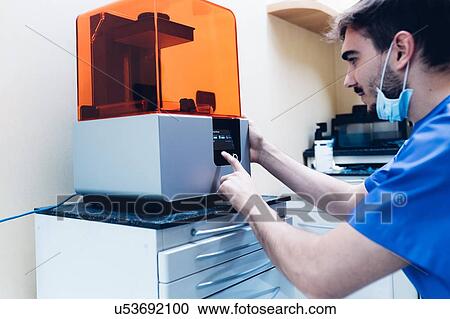 Male dentist using 3D printer View Large Photo Image Stock Image - Male dentist using 3D printer. Fotosearch