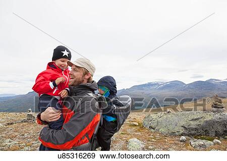 Male hiker with sons in mountain landscape, Jotunheimen National Park, Lom, Oppland, Norway View Large Photo Image Stock Photo - Male hiker with sons in mountain landscape, Jotunheimen National Park, Lom, Oppland, Norway. Fotosearch