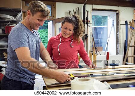 Man and woman in workshop, making ski equipment View Large Photo Image Stock Image - Man and woman in workshop, making ski equipment. Fotosearch