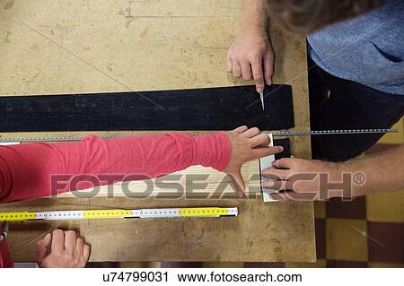 Man and woman in workshop, making ski equipment, overhead view View Large Photo Image Stock Image - Man and woman in workshop, making ski equipment, overhead view. Fotosearch