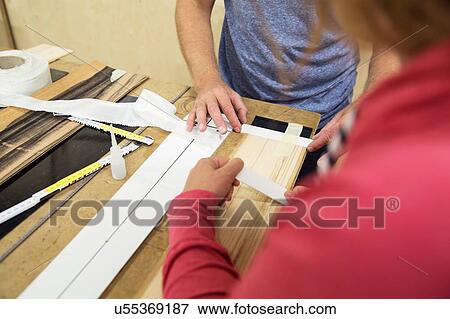 Man and woman in workshop, making ski equipment, mid section View Large Photo Image Stock Photo - Man and woman in workshop, making ski equipment, mid section. Fotosearch