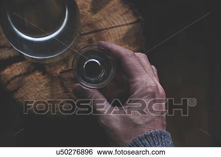 Stock Photograph - Man drinking rakija.. Fotosearch