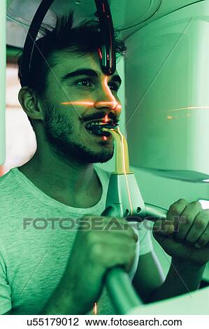 Stock Image - Man having dental x-ray. Fotosearch
