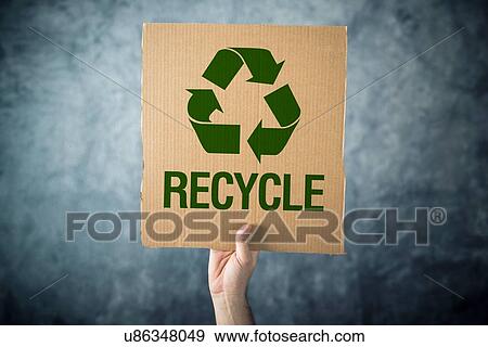 Man holding cardboard with Recycle symbol printed. View Large Photo Image Stock Photo - Man holding cardboard with Recycle symbol printed.. Fotosearch