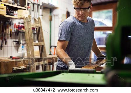 Man in workshop, making ski equipment View Large Photo Image Stock Image - Man in workshop, making ski equipment. Fotosearch