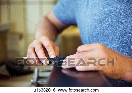 Man in workshop, making ski equipment, mid section, close-up View Large Photo Image Stock Photograph - Man in workshop, making ski equipment, mid section, close-up. Fotosearch