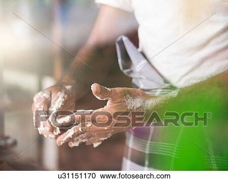 Man removing roti dough from fingers View Large Photo Image Stock Image - Man removing roti dough from fingers. Fotosearch