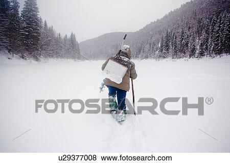 Stock Photo - Man walking in heavy snow landscape, Ural, Sverdlovsk, Russia. Fotosearch