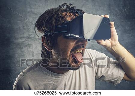 Stock Photography - Man watching 3d virtual content, conceptual image.. Fotosearch