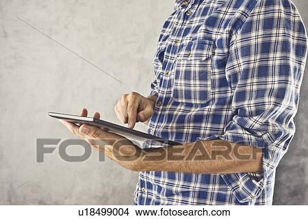 Picture - Man with digital tablet computer.. Fotosearch