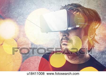 Stock Photo - Man with virtual reality goggles.. Fotosearch