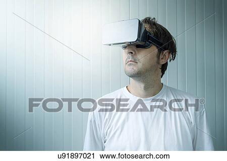 Man with VR headset goggles. View Large Photo Image Stock Image - Man with VR headset goggles.. Fotosearch