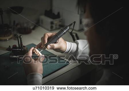 Man working on dental prosthesis. View Large Photo Image Stock Photo - Man working on dental prosthesis.. Fotosearch