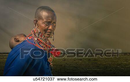 Masai woman with child in a masai village, Amboseli, Rift Valley, Kenya View Large Photo Image Stock Photo - Masai woman with child in a masai village, Amboseli, Rift Valley, Kenya. Fotosearch