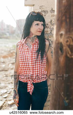 Mature female hipster by demolished building View Large Photo Image Stock Photography - Mature female hipster by demolished building. Fotosearch