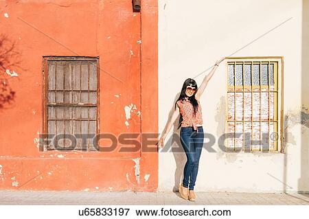 Mature female hipster posing on sidewalk, portrait View Large Photo Image Stock Photo - Mature female hipster posing on sidewalk, portrait. Fotosearch