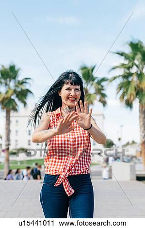 Mature female hipster walking in park, portrait, Valencia, Spain View Large Photo Image Stock Image - Mature female hipster walking in park, portrait, Valencia, Spain. Fotosearch