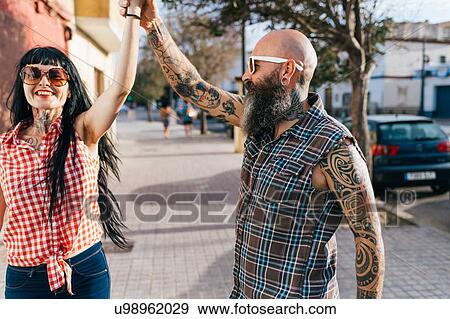 Mature hipster couple dancing on sidewalk View Large Photo Image Stock Photo - Mature hipster couple dancing on sidewalk. Fotosearch