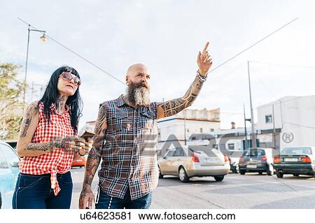 Mature hipster couple hailing a cab, Valencia, Spain View Large Photo Image Stock Image - Mature hipster couple hailing a cab, Valencia, Spain. Fotosearch
