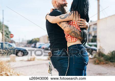 Mature hipster couple hugging each other View Large Photo Image Stock Photograph - Mature hipster couple hugging each other. Fotosearch