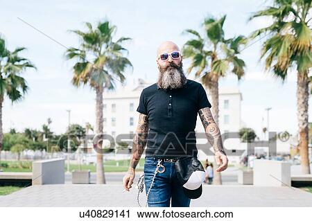 Mature male hipster strolling in Valencia, Spain View Large Photo Image Stock Image - Mature male hipster strolling in Valencia, Spain. Fotosearch