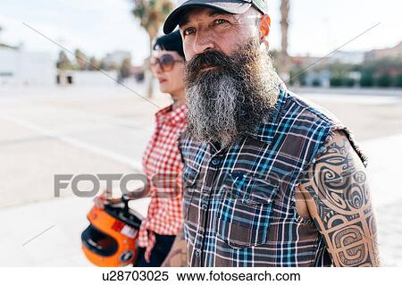 Mature tattooed hipster couple strolling, Valencia, Spain View Large Photo Image Stock Photography - Mature tattooed hipster couple strolling, Valencia, Spain. Fotosearch