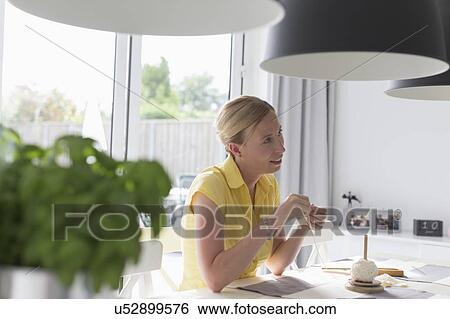 Mature woman making macrame at table View Large Photo Image Stock Photograph - Mature woman making macrame at table. Fotosearch