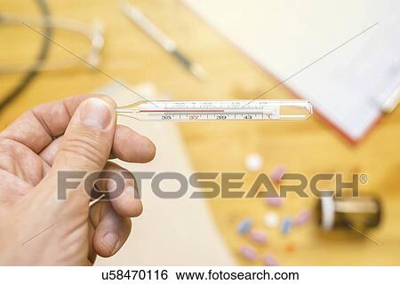 Measuring body temperature. View Large Photo Image Stock Photograph - Measuring body temperature.. Fotosearch