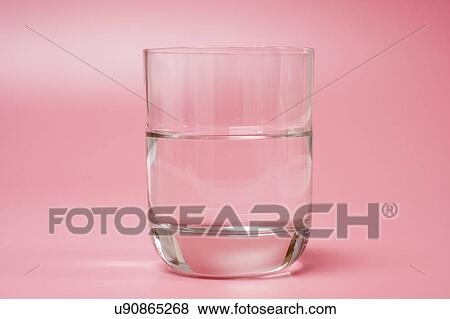 Medication and glass of water on a red background. View Large Photo Image Stock Photo - Medication and glass of water on a red background.. Fotosearch