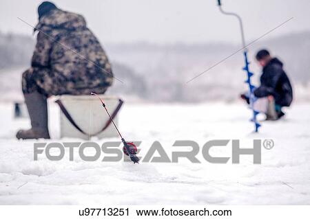 Stock Image - Men ice-fishing, Ural, Sverdlovsk, Russia. Fotosearch
