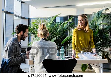 Mentor and colleagues having meeting View Large Photo Image Stock Photography - Mentor and colleagues having meeting. Fotosearch