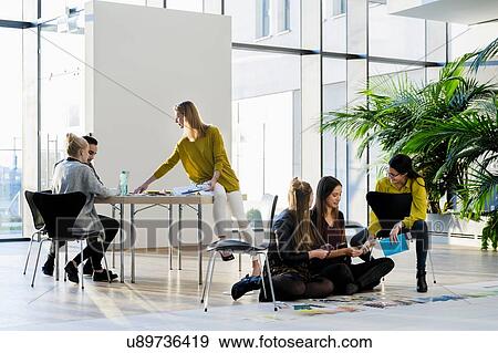 Mentor and colleagues working with colour swatches View Large Photo Image Stock Photo - Mentor and colleagues working with colour swatches. Fotosearch