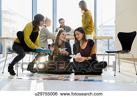 Mentor and colleagues working with colour swatches View Large Photo Image Stock Photograph - Mentor and colleagues working with colour swatches. Fotosearch