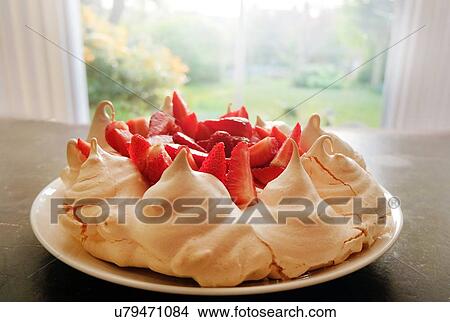 Picture - Meringue and strawberry dessert on plate, close-up. Fotosearch