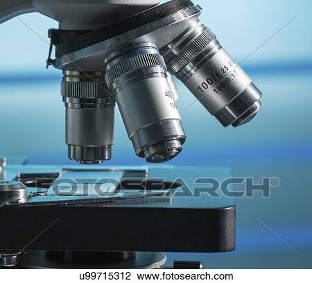 Stock Image - Microscope stage and lenses.. Fotosearch