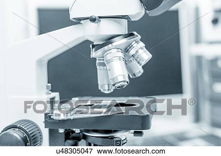 Stock Photo - Microscope stage and lenses.. Fotosearch