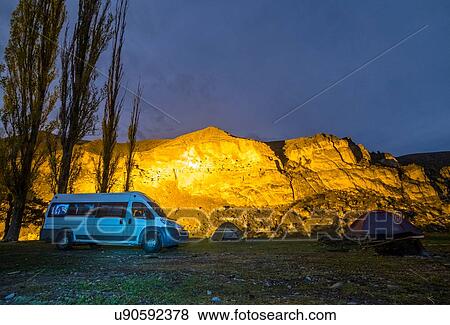 Stock Photo - Minibus parked at campsite. Fotosearch