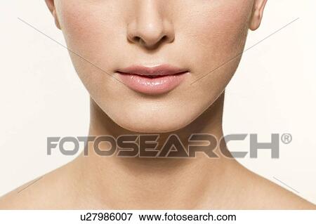 MODEL RELEASED. Young woman's lower face, close up portrait. View Large Photo Image Stock Photo - MODEL RELEASED. Young woman's lower face, close up portrait.. Fotosearch